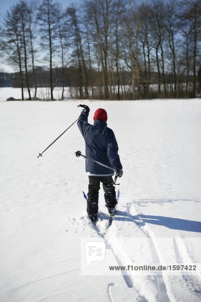 Boy cross country skiing Skane Sweden.