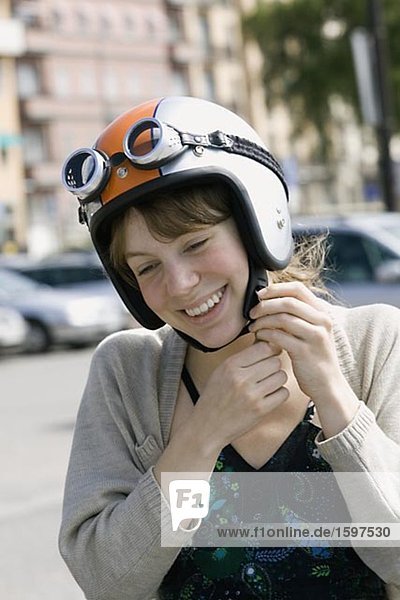 Young Scandinavian smiling woman with a helmet Sweden.