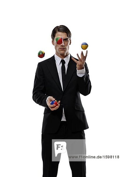 A businessman juggling Sweden.