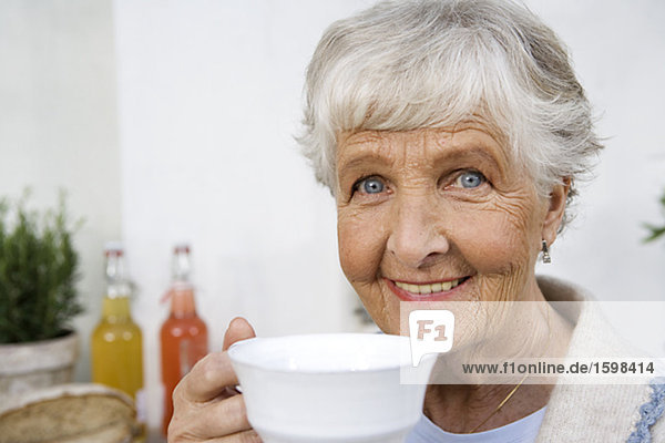 Woman drinking a cup of coffee Sweden.