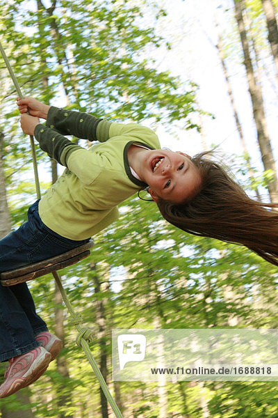 Girl swinging outdoor
