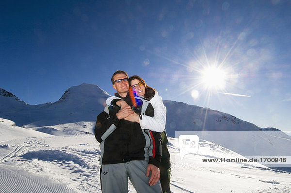 Austria  Salzburger Land  Couple embracing in mountains