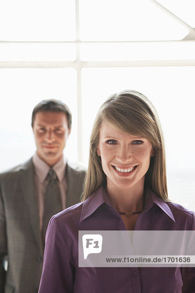 Two businesspeople  man and woman smiling