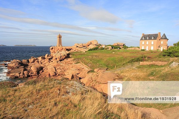 Lighthouse and house at coast  Ploumanac'h  Cote de Granite Rose  Cote d'Armor  Brittany  France