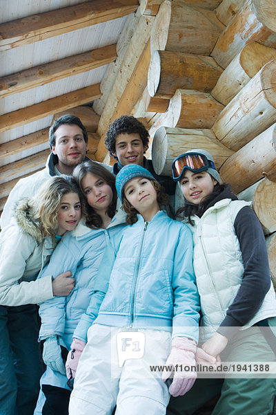 Group portrait in winter clothes  three quarter length  low angle view