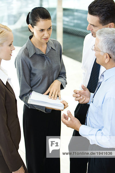 Business associates standing together  discussing  high angle view