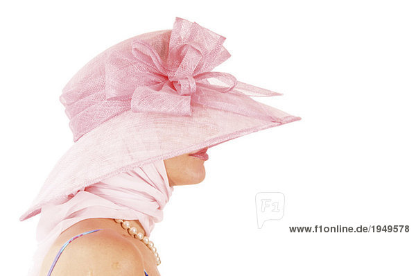 Frau mit rosa Hut