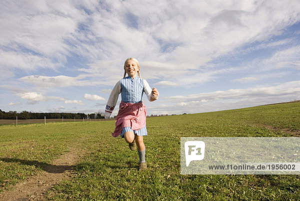 Girl running on meadow