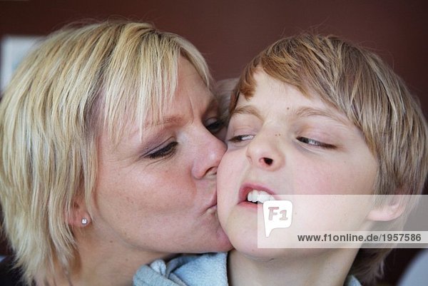 Mother kissing her son