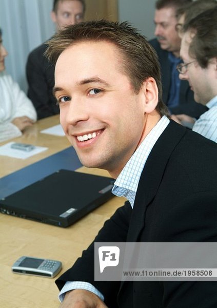Portrait of young man at a meeting