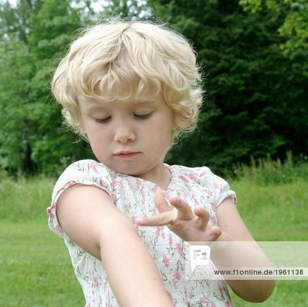 Girl scratching her arm