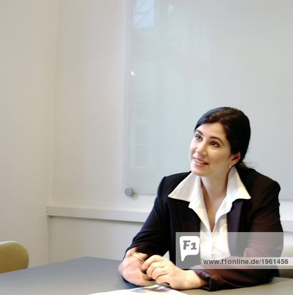 Businesswoman sitting in the conference room