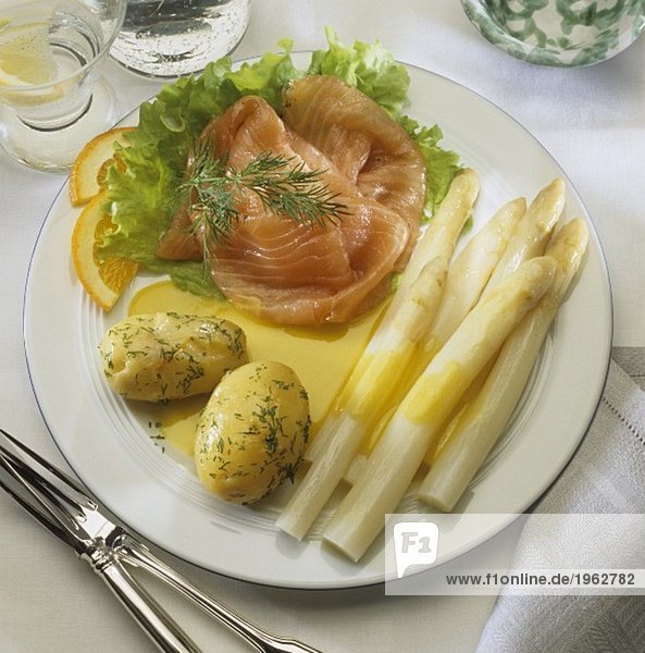 White asparagus with salmon  potatoes and orange sauce