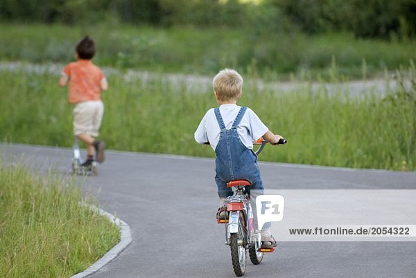 A young boy riding a bicycle