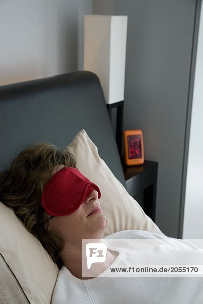 A woman wearing an sleep mask