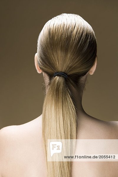 Rear view of a woman with a long ponytail