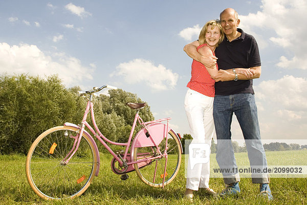 Mature couple riding bike