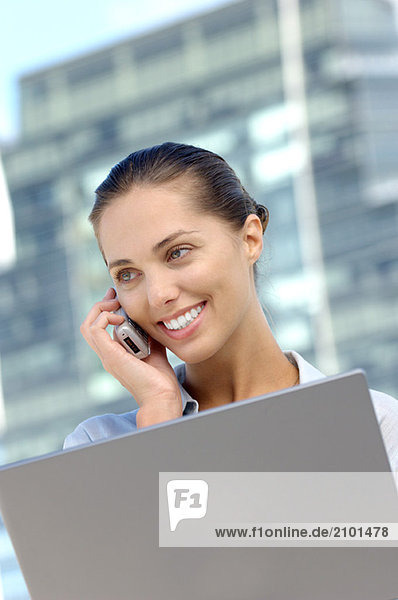 Young businesswoman using mobile phone