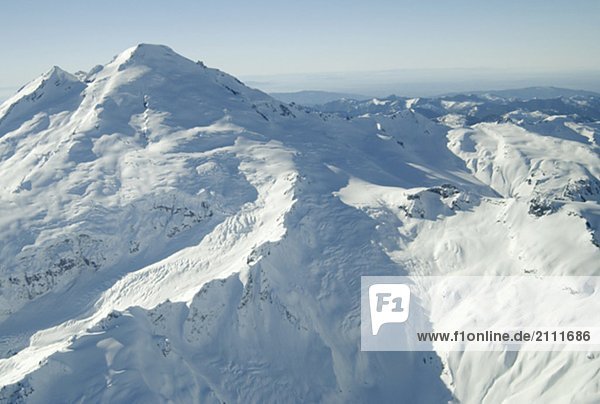 Aerial photo of a dormant snowcapped volcano  Mount Baker  Washington  USA