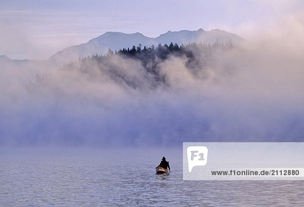 Canoeist on Alta Lake  with mountains and mist