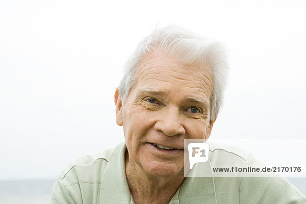 Senior man smiling outdoors  portrait