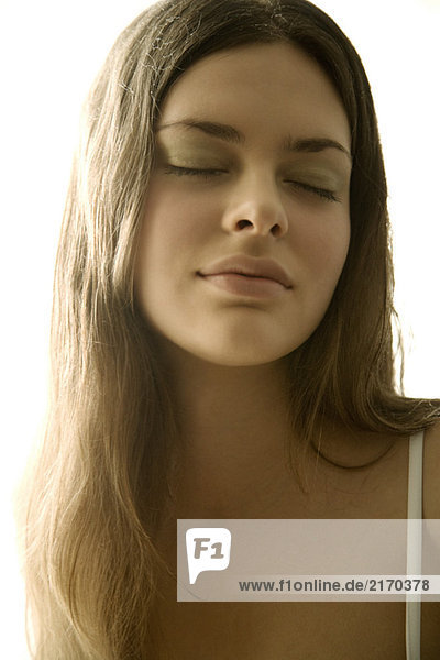 Young woman eyes closed  portrait  close-up