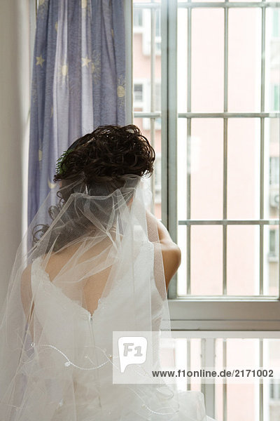 Bride facing window  rear view