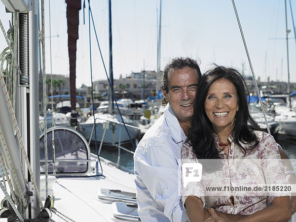 Mature couple relaxing on yacht  smiling  portrait