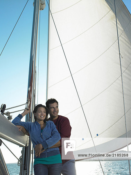 Young couple relaxing on yacht  smiling