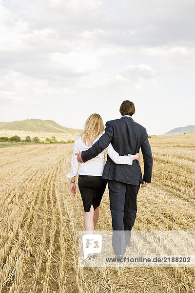 Couple in a wheat field.