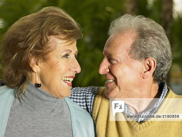 Senior couple smiling at each other  close-up
