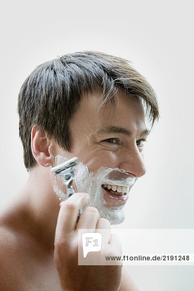 Man shaving.