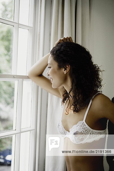 Woman looking out of window.