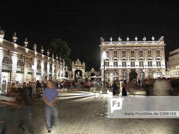 Group of people in front of museum lit up at night  Museum of Fine Arts  The Place Stanislas  Nancy  Lorraine  France