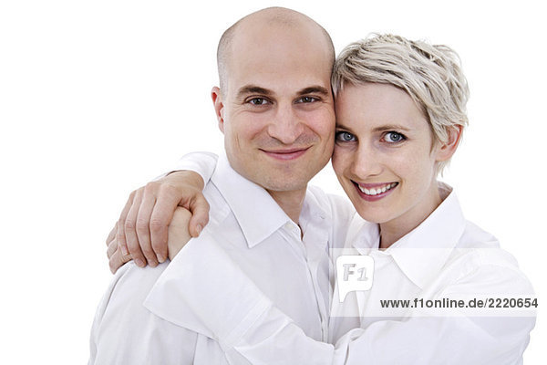 Young couple embracing and smiling  portrait