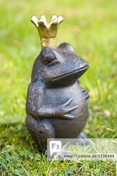 Close-up of figurine of frog prince
