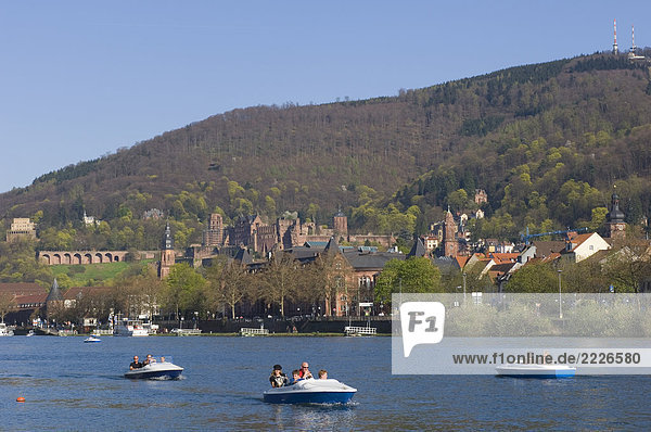 Tourists on paddleboats in river  RiverNeckar  Heidelberg  Baden-Wuerttemberg  Germany