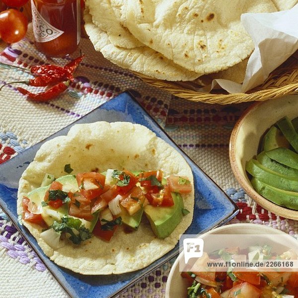 Tortilla with avocado and tomato filling