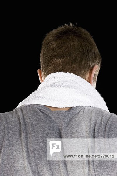 A man with a towel around his neck