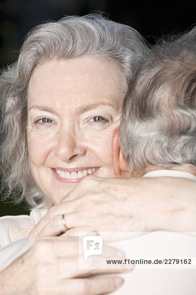 A senior couple embracing