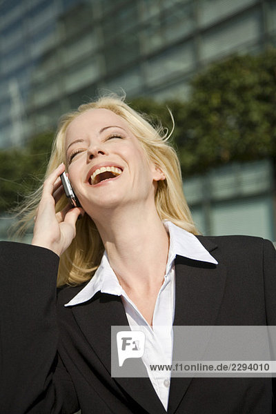 Business woman phoning  portrait