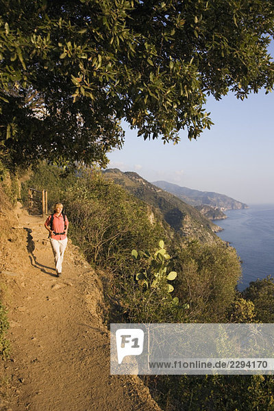 Italy  Liguria  Vernazza  Woman hiking on pathway