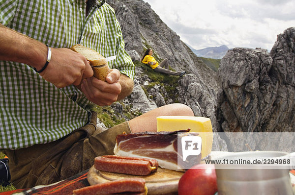 Austria  Salzburger Land  couple having a picnic