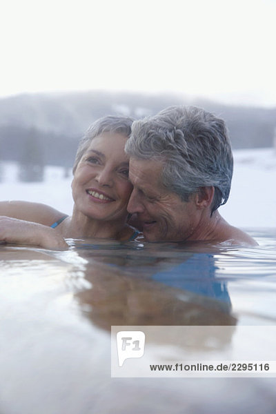 Mature couple relaxing in outdoor spa  portrait