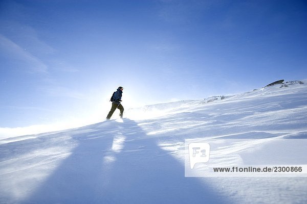 Skier climbing a mountain Sweden