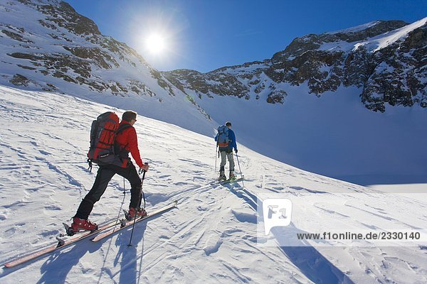 Two skiers skiing Ennstal Obersteiermark Obertal Vetternspitze Sauberg Austria