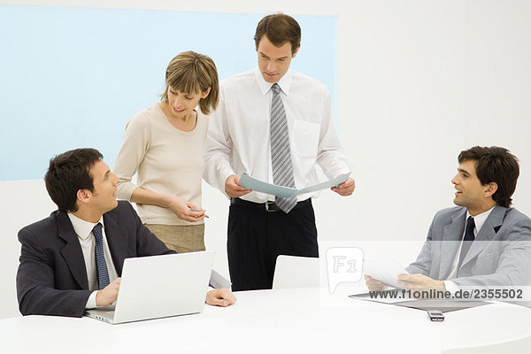 Business executives working together in office