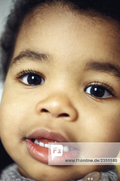 Toddler boy smiling at camera  close-up  portrait