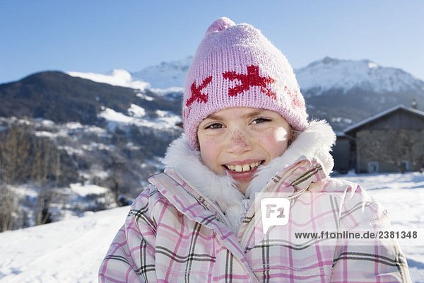 Portrait of young girl in the snow