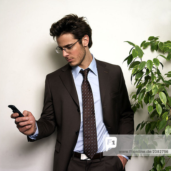 Man holding phone in office
